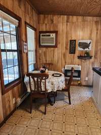 Lots of natural light. Looking out to the covered front porch on the left.