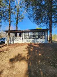 Outside view of the living room and covered porch.