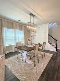Upon entry you are surrounded by natural light, neutral colors & designer features. Adjacent to the kitchen is this perfect room for casual or formal dining.