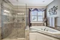 New glass doors added to this beautiful and spacious shower.