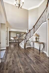 Fresh paint, new hardwoods and natural light make this a lovely way to enter this beautiful home!