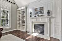 This great room feels elegant with the thoughtful and tasteful use of custom millwork surrounding the gas fireplace.