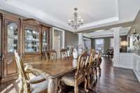 Another view of the dining room overlooking the living room / music room in the back and the kitchen to the left.  Such a great flow!