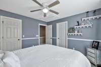 Chair molding adds a decorative touch to this nice sized bedroom.