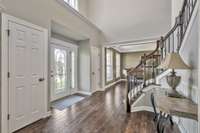 This spacious two story entry with elegant curved staircase adds so much light to this beautiful home.