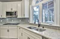 Who does not love doing dishes while overlooking your beautiful yard with custom porch from The Porch Company.