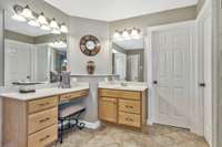 An additional make-up vanity is included in this owners bathroom providing even more storage.