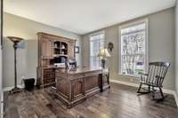 A dedicated study with double glass french doors is located off the entry.  Two giant windows allow for an abundance of natural light for a peaceful environment.