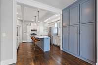 Discover ample storage solutions within pantry cabinets and a convenient walk-in pantry, ensuring plenty of space to keep your kitchen organized and well-stocked