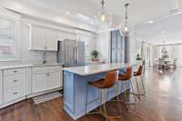 Step into this bright and spacious kitchen, connecting to both the dining room and family room for effortless flow and interaction