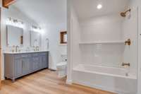 This bathroom was also just renovated with new flooring, new vanity, mirrors, lighting and tub/shower combo unit.  The brass fixtures fit this room perfectly.