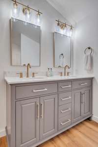 The double vanity with two large mirrors are both stylish and perfect for getting ready in the morning.