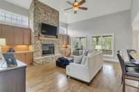 Spacious living room with built in cabinets, granite counter tops, and this STUNNING stone fireplace.