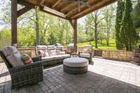 Outdoor living area.  Infrared heater for cooler, fall nights.  6 foot fire pit, smoker, grill, mini fridge, and sink.