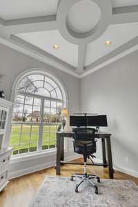 View of the coffered ceiling from the office.  The huge window allows for the natural light to come through.