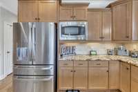 Beautiful, high end cabinets through out the spacious kitchen will give you plenty of storage space.