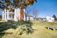 East side of home with pastoral sitting areas