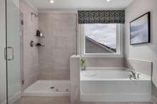 Primary Bathroom with walk-in shower and separate tub! Also available with an oversized shower at no additional cost!