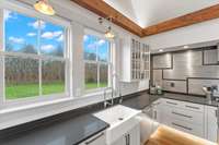 The owner designed the kitchen with ample windows to provide natural light and scenic views.