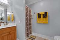 Master bathroom with separate shower.