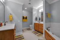 Master bath with two sinks,whirlpool,and separate shower.