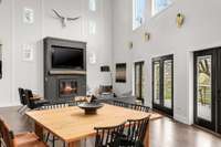 High ceiling and windows bring in natural light to the spacious living area.