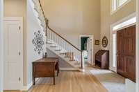 Entry way/Foyer with an office just beyond the stairs.