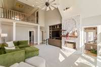 Living room with balcony and door to sun room to the right.