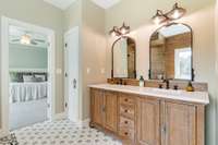 Completely remodeled primary bathroom with dual vanities.