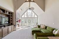 Beautiful open sunny Living Room.  An even better view of the countryside through the wall of windows.