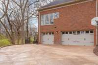 3 car garage and access to the fenced in backyard