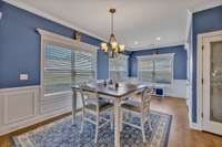 The spacious dining area features a multitude of big windows, allowing abundant natural light to filter in, accentuated by charming wainscotting. 1133 Corona Ct   Lascassas, TN 37085