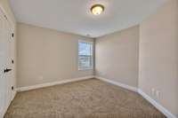 Bedroom 2 features carpet floors, neutral paint tones, and a single window! 1133 Corona Ct   Lascassas, TN 37085