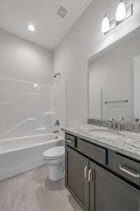 Bathroom   *Photo is of a previously built Riviera & another Dalamar Homes Community. Standard features & selections may vary.*