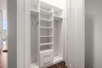 Ample storage offered throughout the home is highlighted by this spacious entry closet.