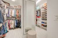 His and Hers Large Walk-in Closets customized by California Closets