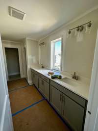 This is the Owner's bath with tons of cabinets/countertop space. Pictures are of another Leighland  floorplan in a different community, finishes may be different.