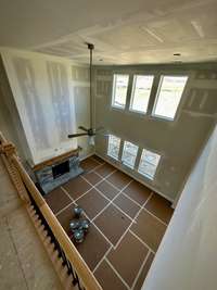 View of the two story family room from the upstairs. Pictures are of another Leighland  floorplan in a different community, finishes may be different.