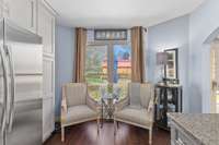 Plenty of room for a small table by the window. Stainless refrigerator with a custom built in pantry surround.