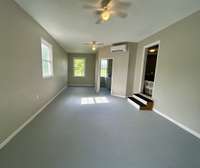 Renovated Den with laundry room, right off the kitchen.