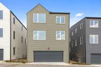 This home has an attached oversized garage and garage door