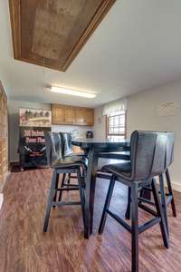 Studio style space with washer and dryer hookups and mini kitchen.