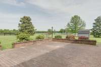 Secluded Patio with Views of farm land as far as you can see. (Dog pens and shed go with the owner, opening up the scenic view)