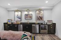 A perfect entertaining space - the bar area is equipped with a Scotsman ice maker, beverage cooler, sink and dishwasher