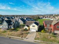 USE THE LARGE SHARED YARD OUT BACK FOR SOCCER GAMES AND CORNHOLE WITH YOUR NEW NEIGHBORS! OR JUST ENJOY THE SPACE FROM YOUR BRAND NEW PATIO.