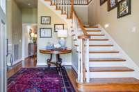 Thetwo story foyer combines functionality & style.  Plenty of room to welcome guests and display a Christmas tree for the holidays