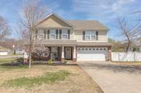 Long driveway perfect for extra cars or guests! Covered front porch and a fenced backyard.