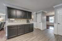 Alternate view of your spacious kitchen.  Plenty of space to add a working island in the middle.  Check out the TWO  pantries!  Either a cleaning supplies/broom closet and a pantry or TWO pantries!