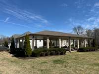 Picnic pavilion area just a few houses down into the culdesac.  Perfect for parties, spending time outdoors, having larger gatherings,  and is equipped with several picnic tables.  It is next to the playground too!