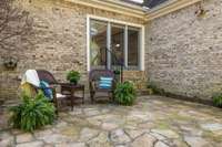 Stone Patio with French Doors to Family Room